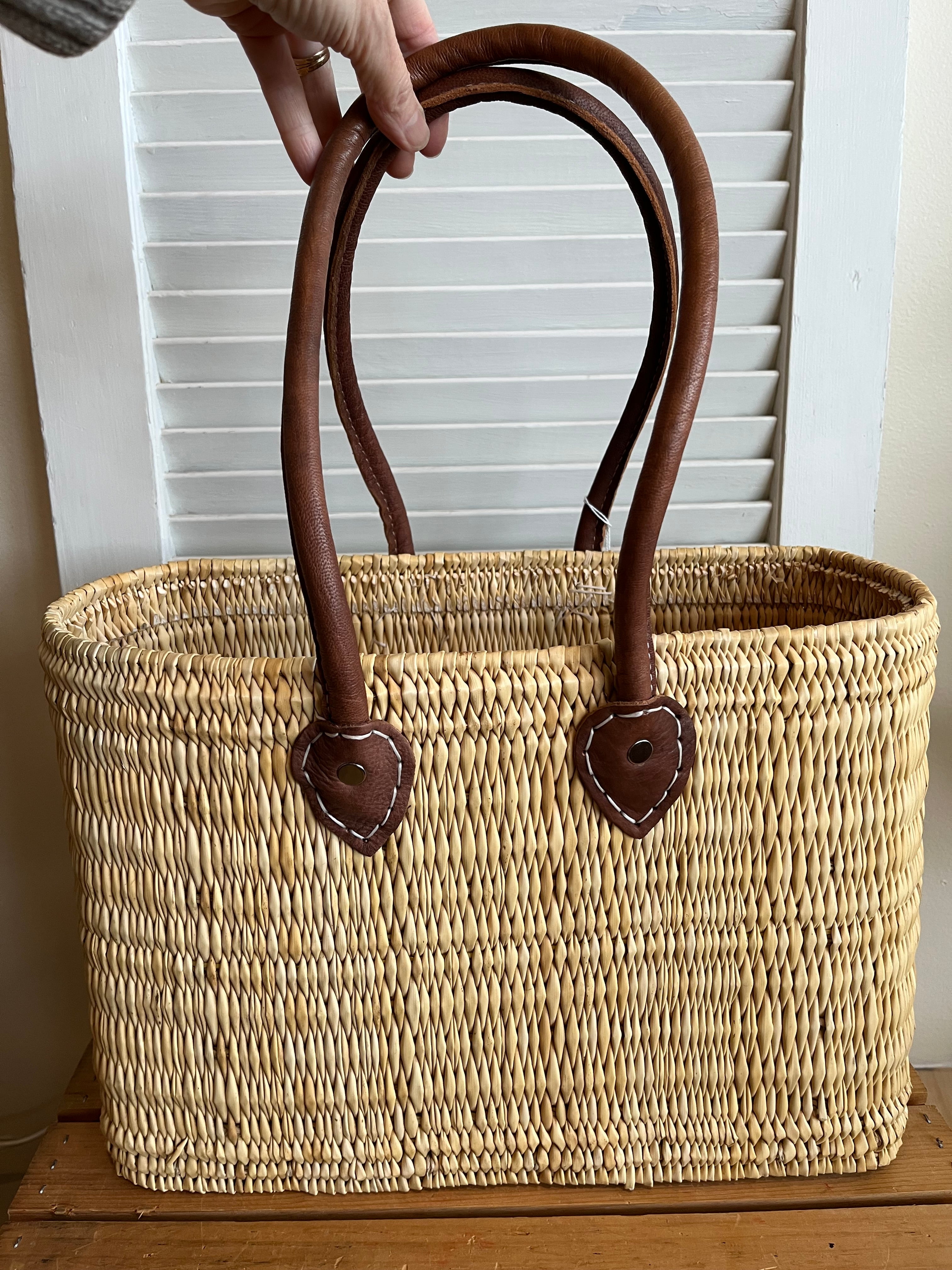 Moroccan tote-style basket with long handles